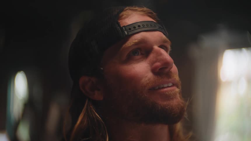 A man looks at something behind the camera