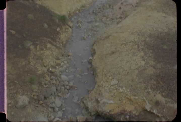 A small empty stream in a muddy ground