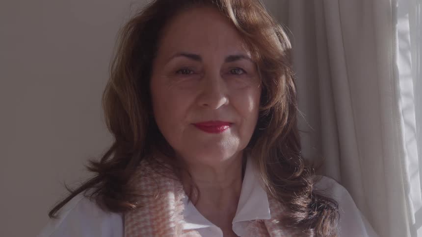 A woman looks at the camera
