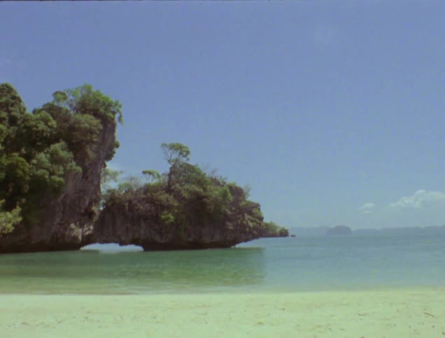 The water washes to the shore of this beach