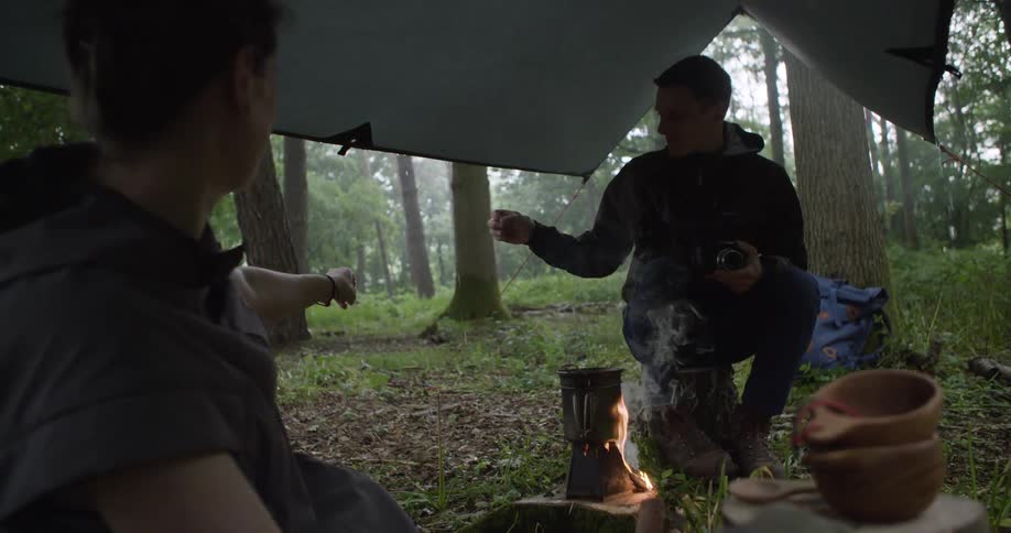 Some guys camping in the rain