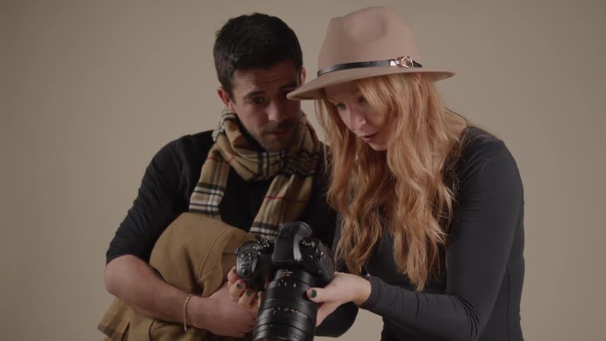 Woman shows the result to the man who watches attentively by her side
