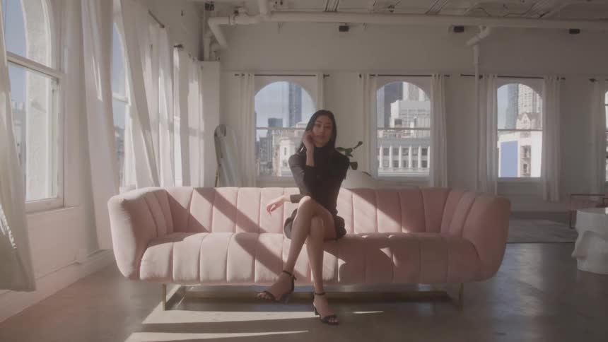 A woman sitting on a sofa