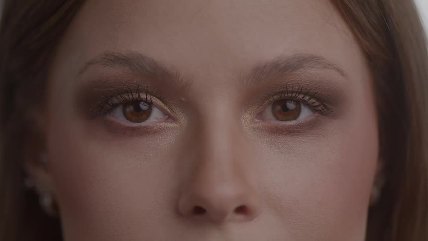A woman looks at the camera
