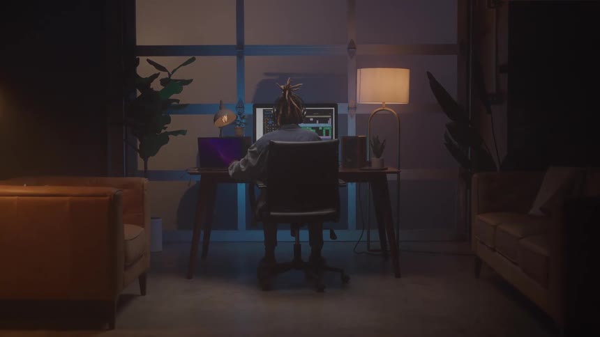 A man sits at his computer