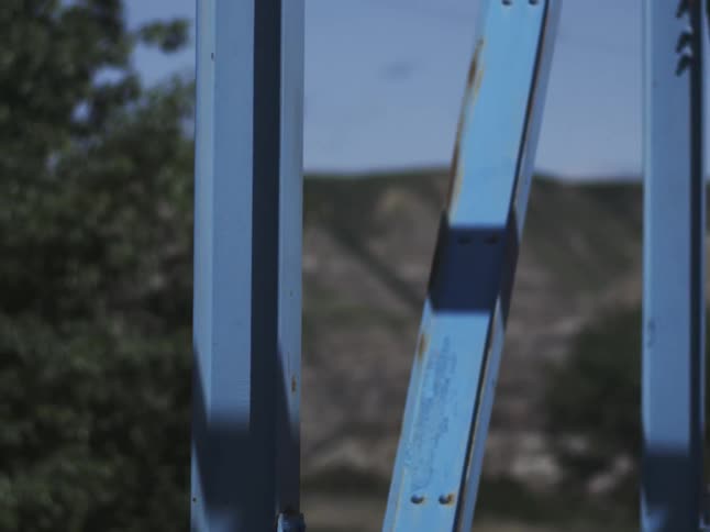 The blue bridge is by the mountains