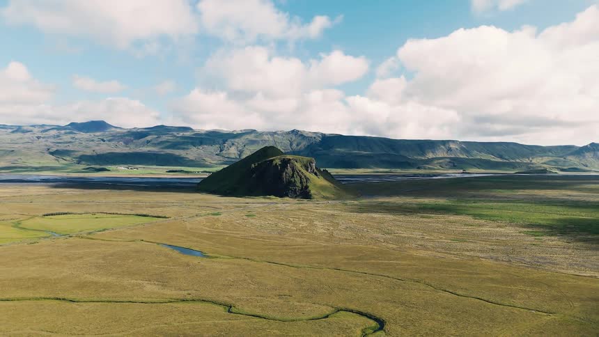 Long green fields cover the landscape