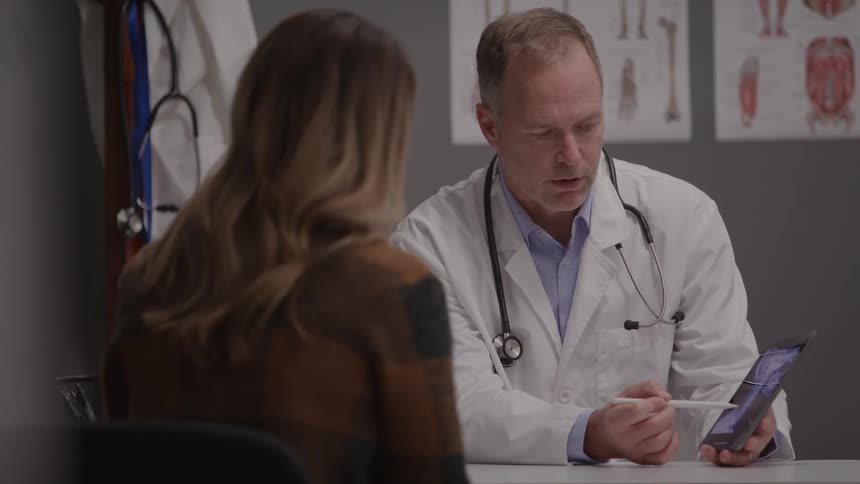 The doctor has a discussion with a patient
