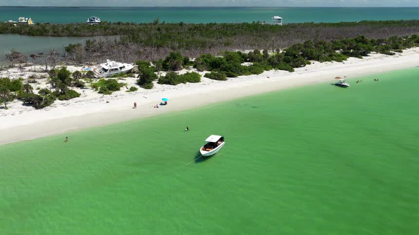 A boat cruising near an island