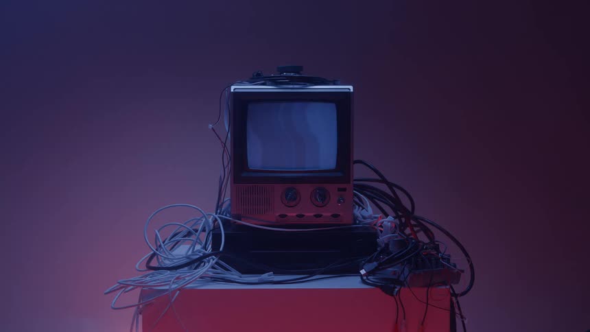 The person turns on the television