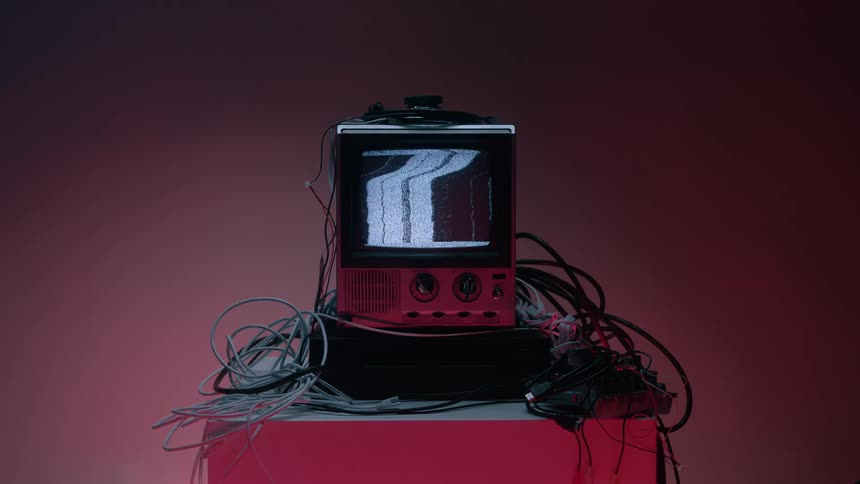 Close up of a connected electronic display device on a table showing a static screen