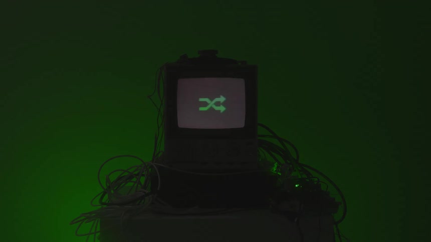 The television is flashing symbols and illuminating the room