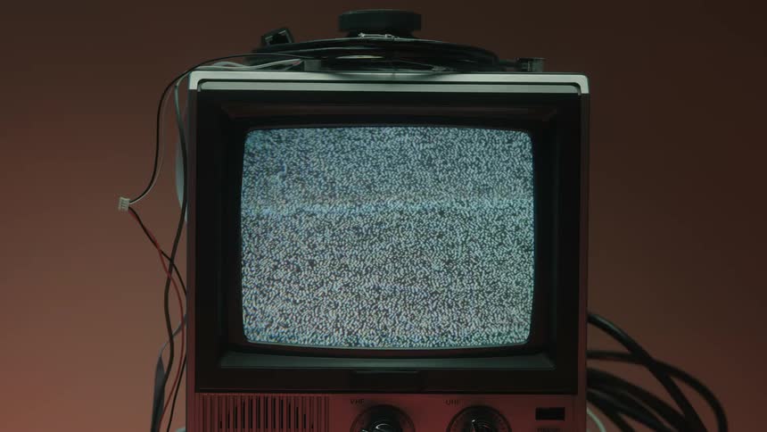 White static fills the television screen