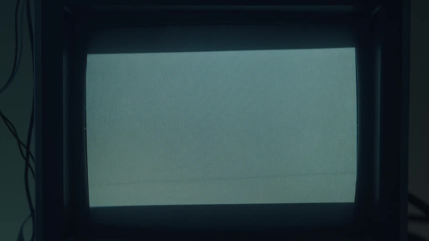 Dark bands expand and retreat to conceal a light gray rectangle on a monitor