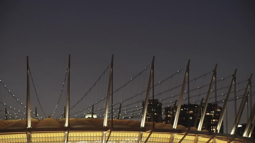 The stadium is brightly lit at night