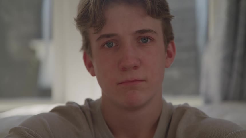 The teenager looks sad