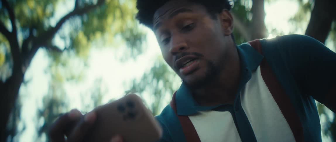 Man watching something on his phone