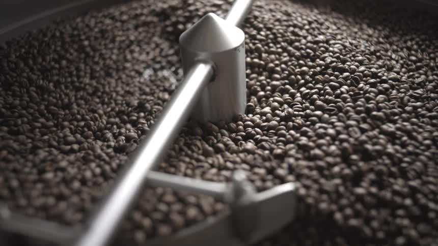 Coffee beans being mixed during the roasting process
