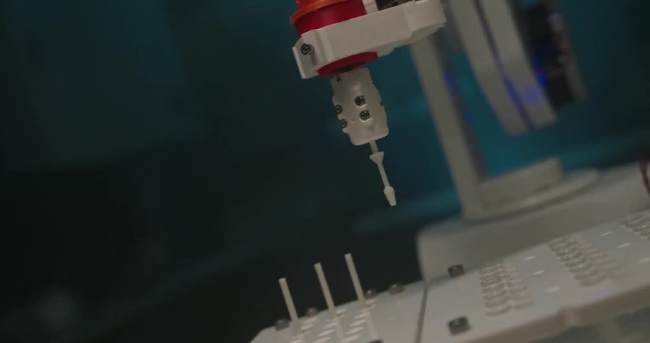 Robotic arm performing a precise operation on a platform in a laboratory