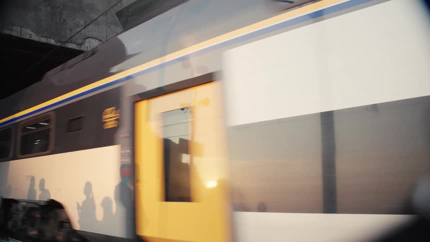 The train exits the dark tunnel