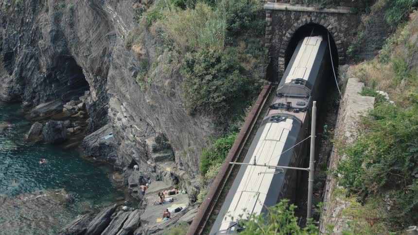 The train enters the dark tunnel