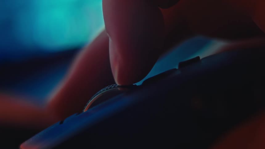 Extreme close up of a person scrolling with a mouse while using a computer