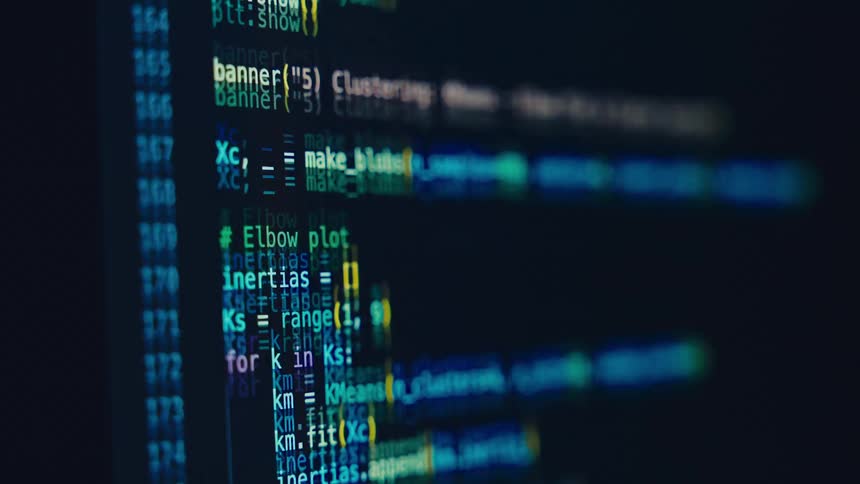 Close up of a computer screen displaying a scrolling coding software interface