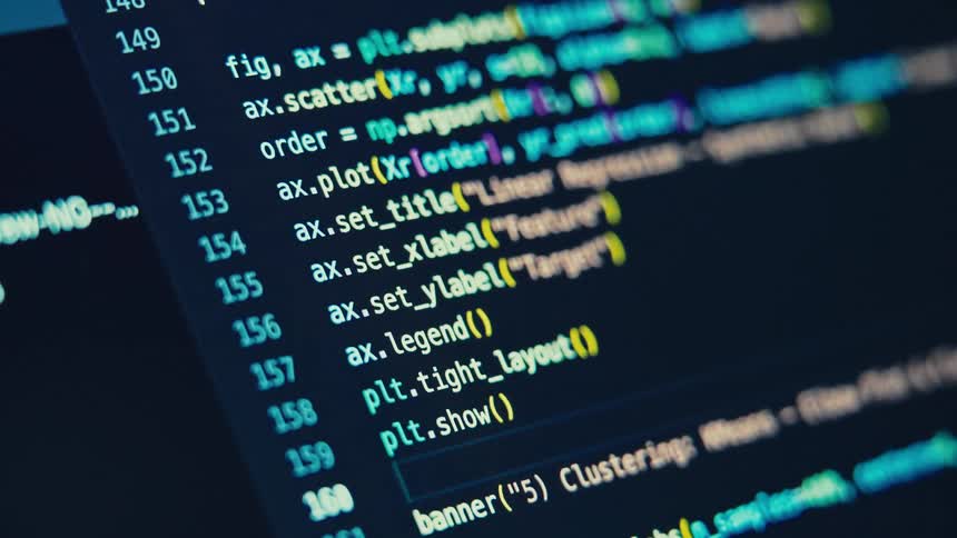A highangle closeup shot of a monitor displays code in a dark programming environment with bright multicolored syntax highlighting the text shows functions and parameters related to machine learning including gridsearchcv and linearregression
