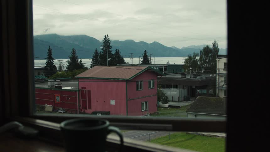 Suburban community with lake and mountains in the background