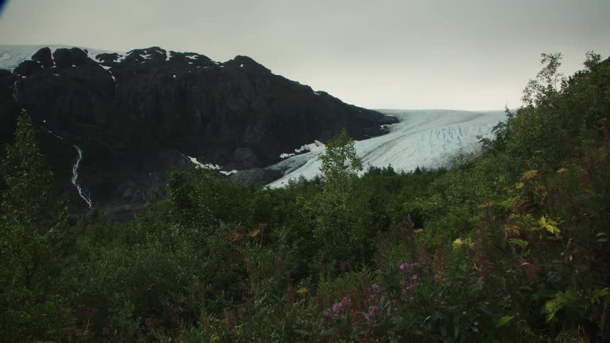 The mountain slope is covered with snow