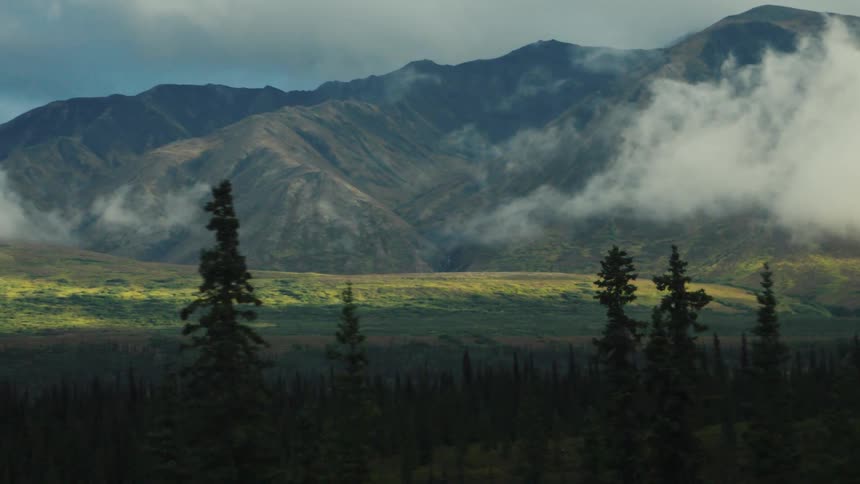 The clouds sit on the mountains