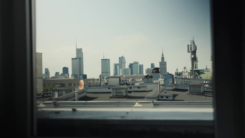 High rise building rooftop in a metropolitan cityscape during daytime