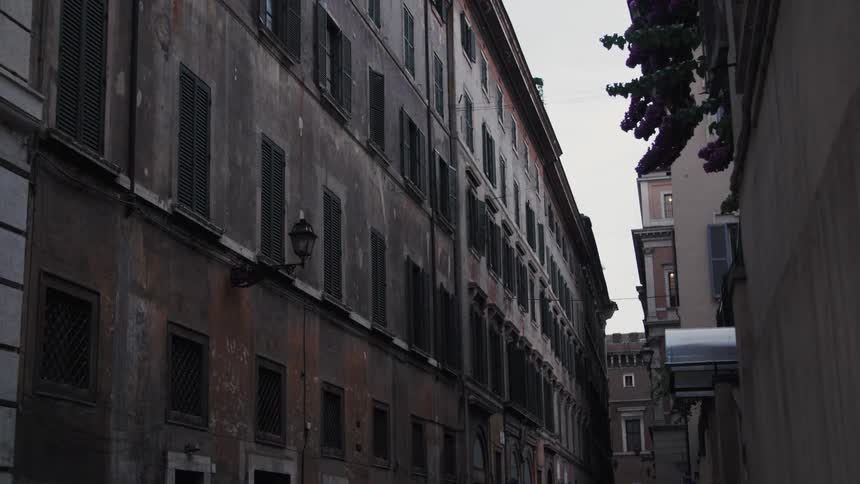 The side of a large multi storey building outdoors in a city during daytime