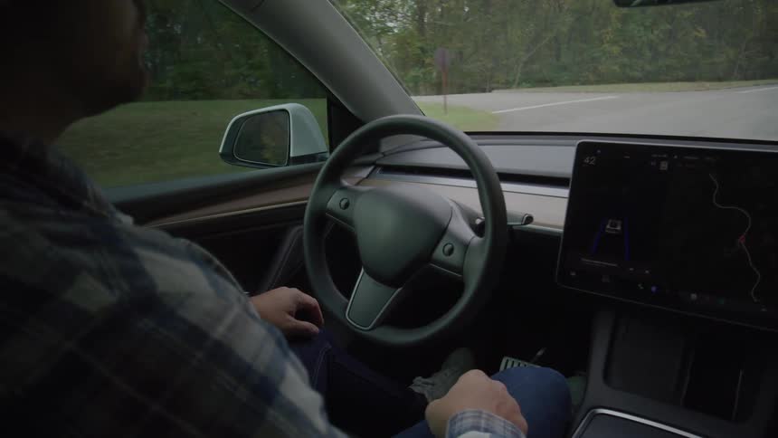 Driver seated while the car operates in autonomous driving mode