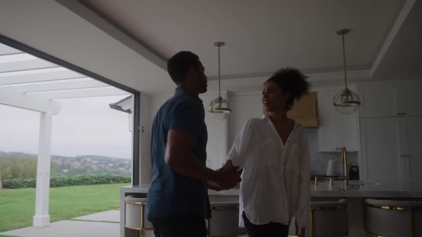 An angry couple is having an argument inside a modern living room