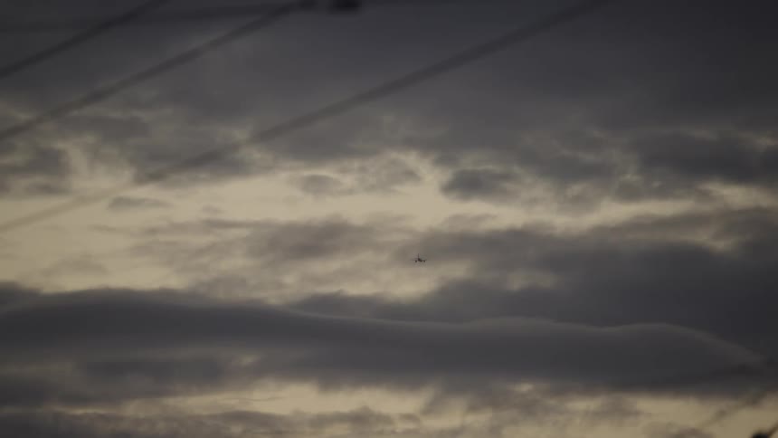 The plane flies through the storm clouds