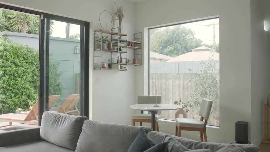 Interior design of a living room with access to a garden