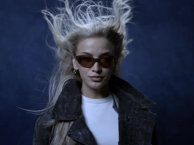 Wind blows the models hair back in the studio