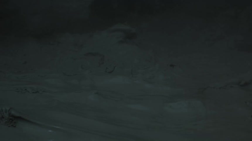 Dark surface of wet ground under low lighting