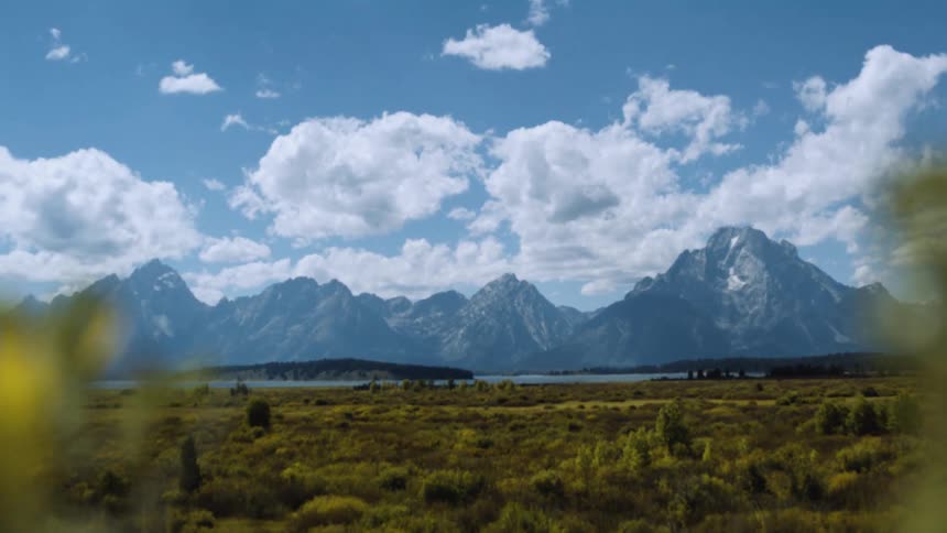A lake sits before the mountains