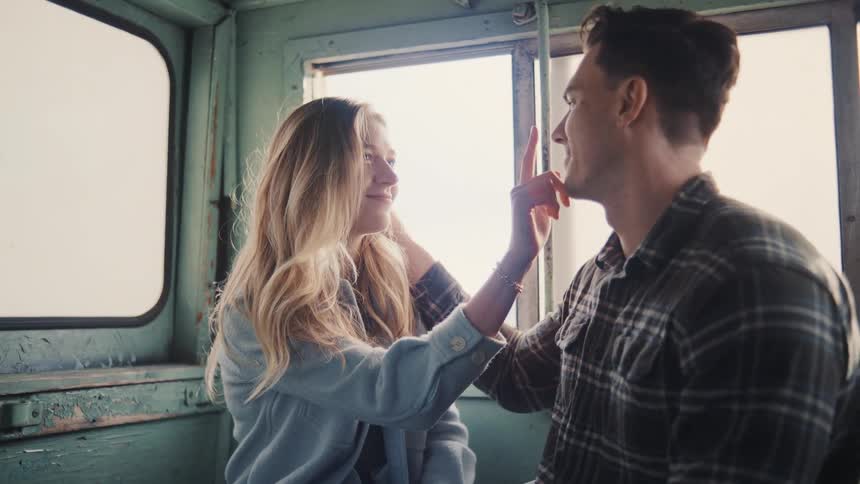 A couple facing each other