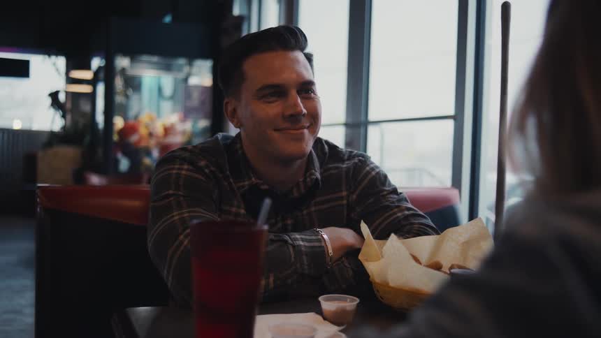 A couple on a date talk in the restaurant