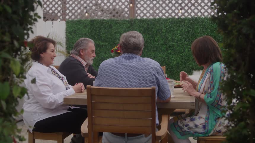People are drinking and talking outside