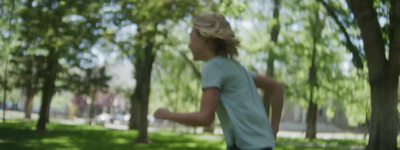 Children are playing tag in the park