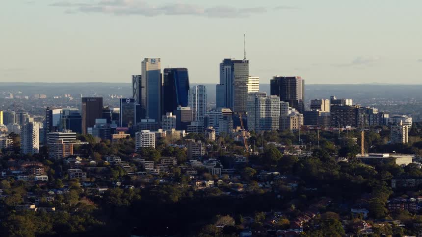 The tall buildings fill the city ahead