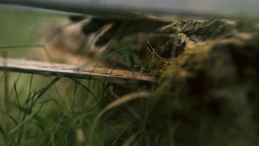 Close up of a garden machinery in use on a field outdoors during daytime