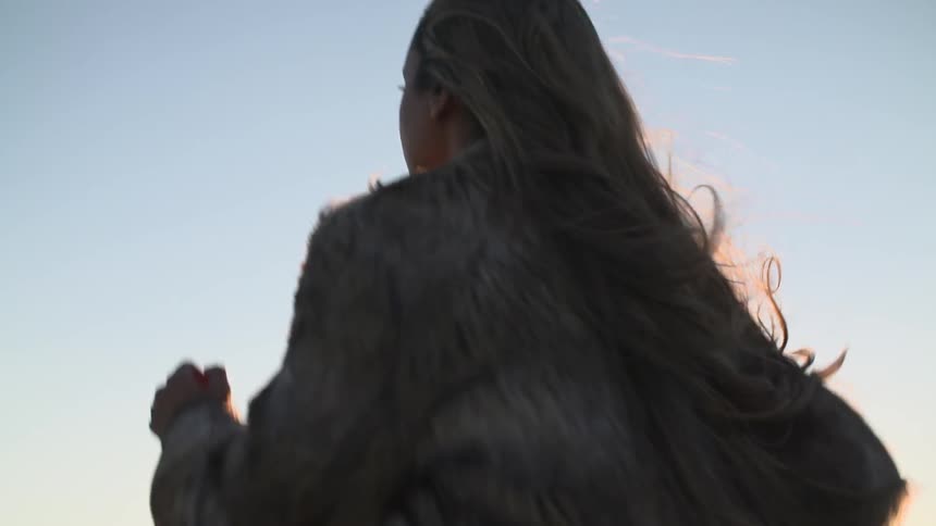 Woman traveling as the sun sets
