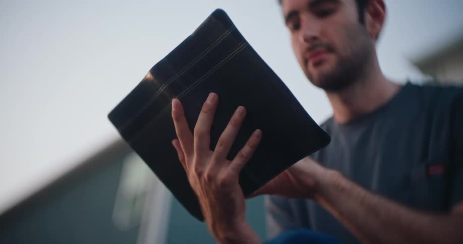 A man reading outside