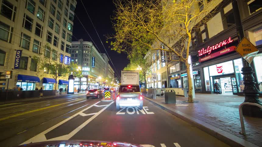 Driving through a city at night