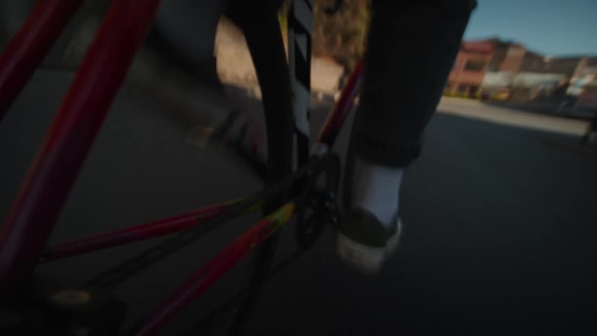 Bicycle pedal in motion on a sunny street